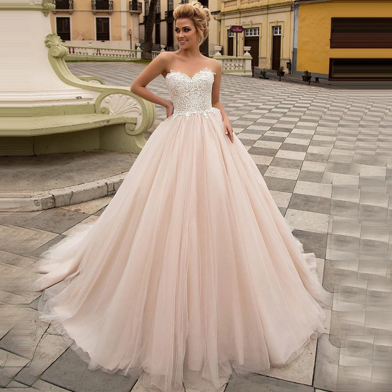 

Lakeydra Sweetheart Ball Gown Wedding Dresses Champagne Tulle Sleeveless with Lace Backless Plus Size Bridal Gowns