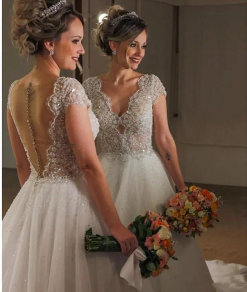 2018-a-line-wedding-dresses-elegant-v-neck-cap-sleeves-lace-applique-beaded-sheer-back-with-buttons-sequins-floor-length-arabic-bridal-gowns (1)