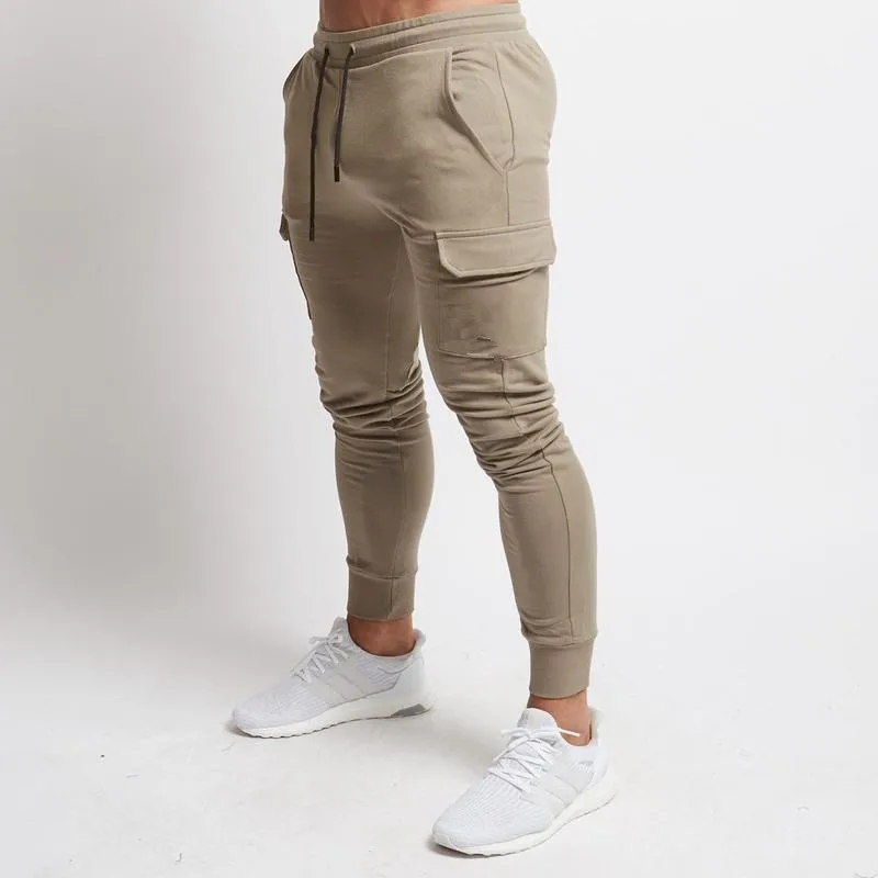 Skup Męskie jesienne bawełniane spodnie dresowe z spodnie z kieszeniami męskie siłownie Fitness kulturystyka spodnie skinny fit męskie spodnie do ćwiczeń Jogger
