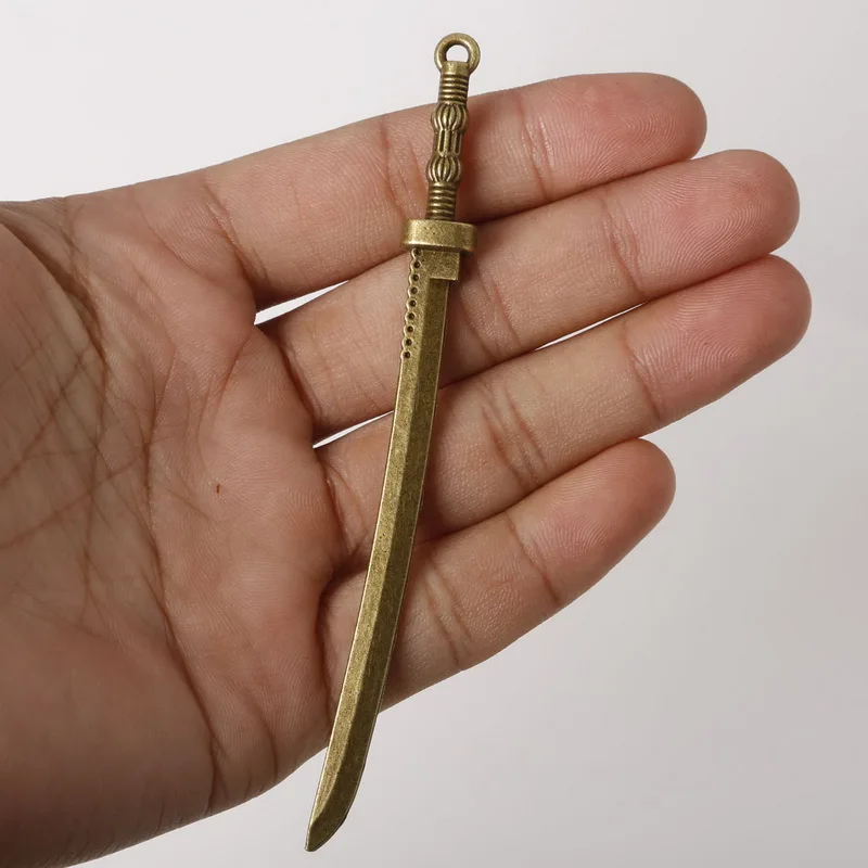 

Hot Fashion 1pcs/bag 10*107mm Antique Bronze Plated Zinc Alloy Revolving Knife Charms Pendants Jewelry Findings For DIY bracelet