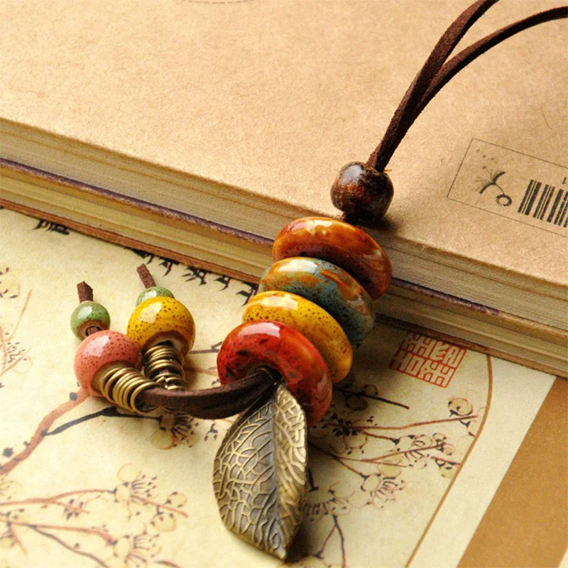 

Leather Necklace Ceramic Beads Pendants Leaf Charm Long Sweater Chain Strand Choker Leaves Tassel Women Men Fashion Jewelry