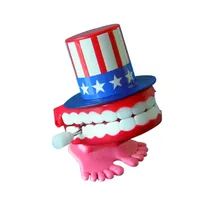 Горячая Забавный Заводной игрушки 7 см Американский флаг ветер-вверх ходьба Babbling зубные протезы болтающие Смешные зубы oyuncak T