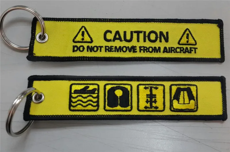 

Caution Do Not Remove From Aircraft Customized OEM Fabric Embroidery Keychains