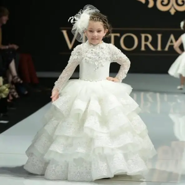 

Long sleeves high neck ivory floor length little girl holy communion dress tiered laces tulle ruffles ball gown flower girl gown