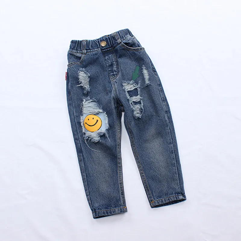 

DFXD 2017 New Baby Girls Jeans Korean Kids Cartoon Smile Face Fashion Hole Trousers Children Ripped Jeans Denim Pants 2-7Years