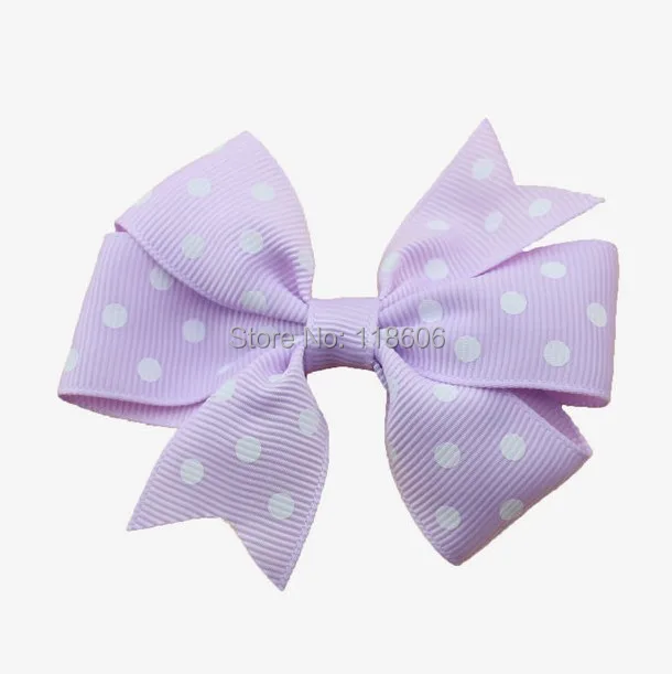 Purple Polka dot pinwheel hair bow.jpg