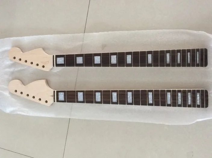 

two necks maple made and rosewood fingerboard strat necks with binding to those dimensions