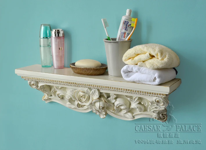 A word shelf/partition of carve patterns or designs on woodwork shelf. Hanging bracket.