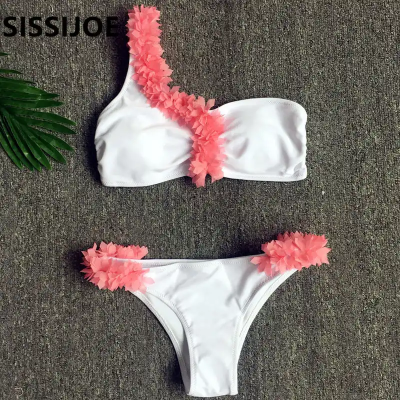 white swimsuit with pink flowers