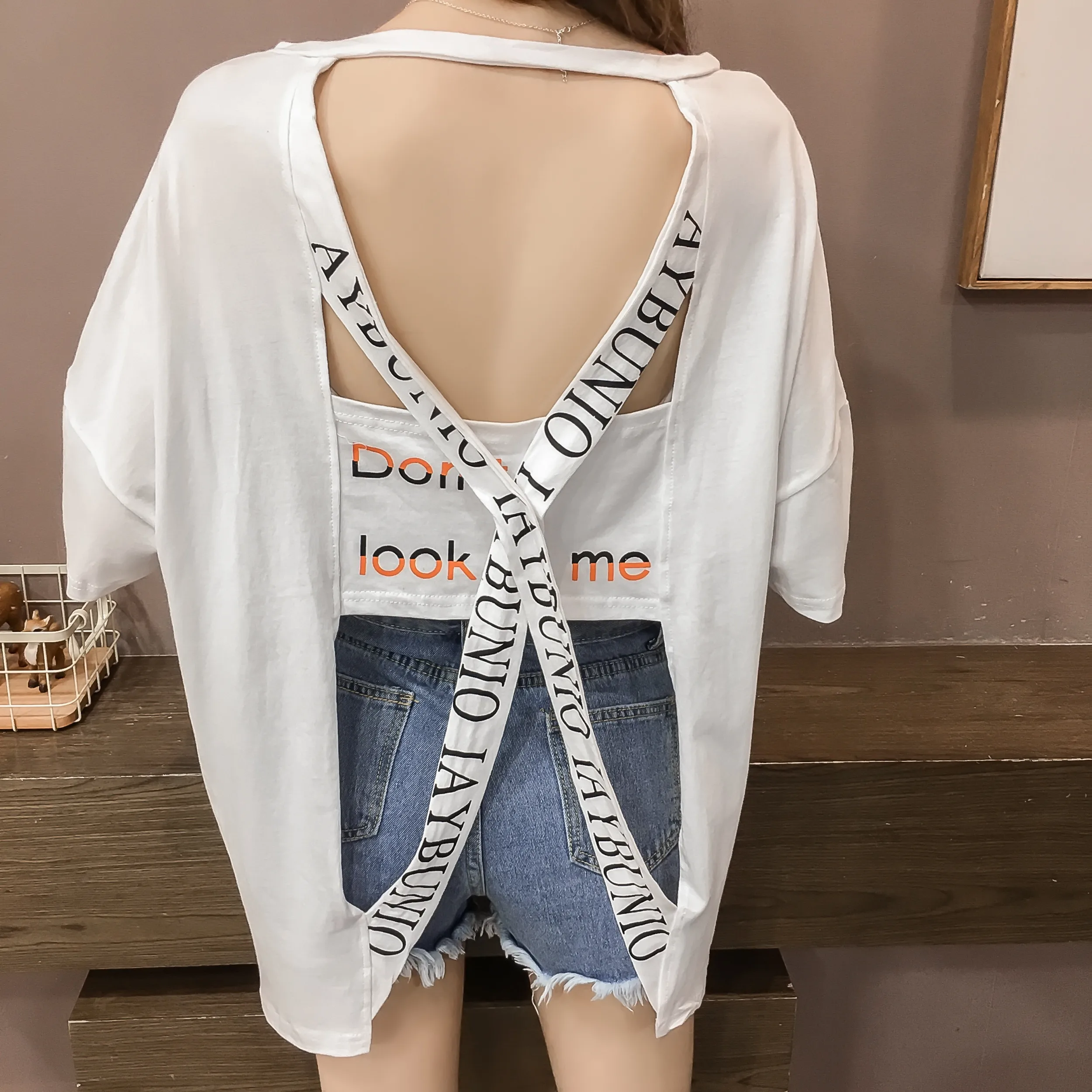 

Casual open back sexy hollow out long t-shirt summer 2019 new half-sleeved Cross belt letter o-neck white t shirt Loose 121i3