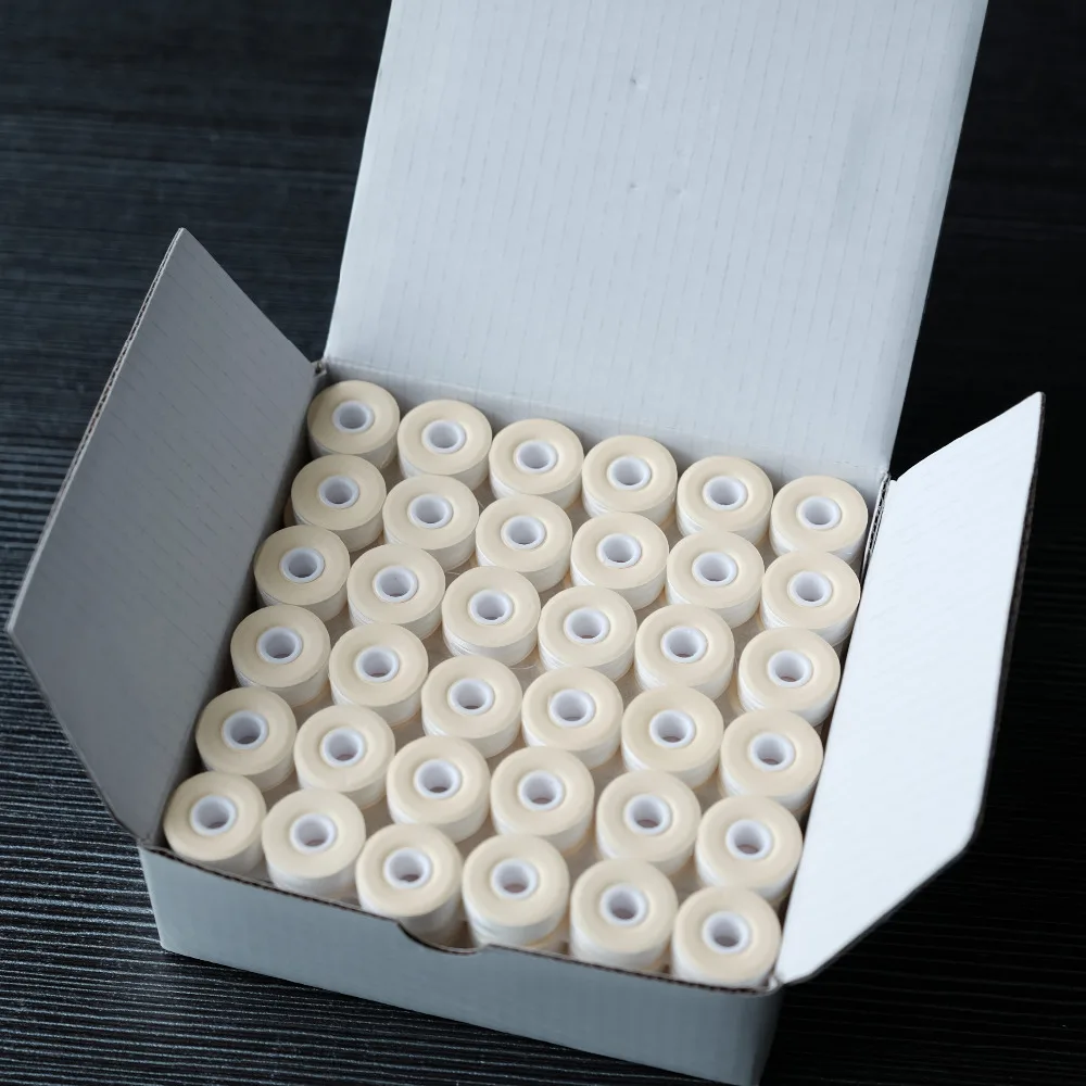 

White Color 144pcs L Type Cardboard Style High Tenacity Polyester 70D/2 Prewound Bobbin Thread Machine Embroidery