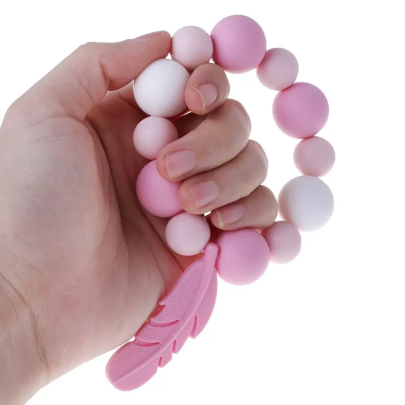 

Baby Teether Bracelet silicone teething ring DIY Feather Decoration Teething Grinding Chew Bite