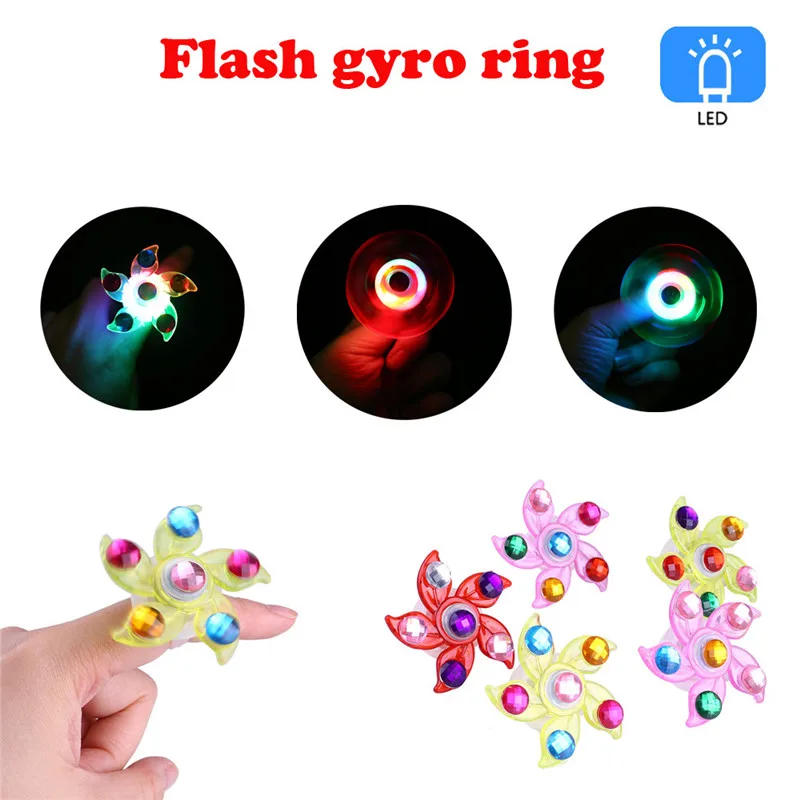 

2019 New Year Christmas Eve Novelty Funny Glowing Toys Children's Luminous Ring Manual Rotating Soft Plastic Flash Gyro Ring New