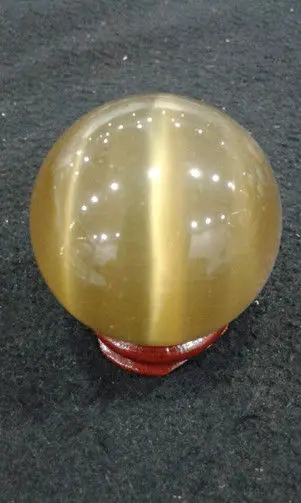 

SCY 6680175+++yellow quartz cat's eye crystal ball 40 mm + stand