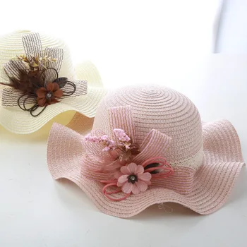 

2019 baby girl hat summer bow straw hat solid color flowers outdoor cool hat Korean casual wave big along beach hat kids beanies
