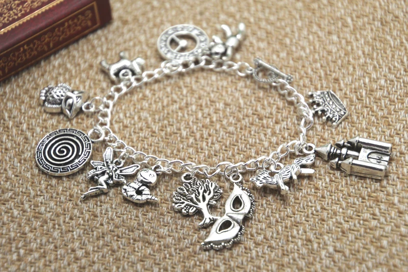 

12pcs Labyrinth inspired bracelet Lancelot the bear Clock Merlin the dog Fairy Worm charm bracelet
