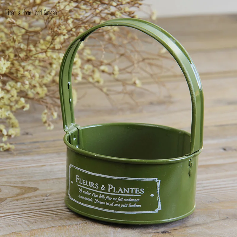 

green painted mini metal flower pot with handle