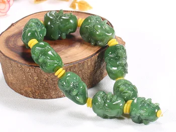 

Hetian yu 18 luo han head string spinach green Buddha head bracelet male and female hand carving double-sided/