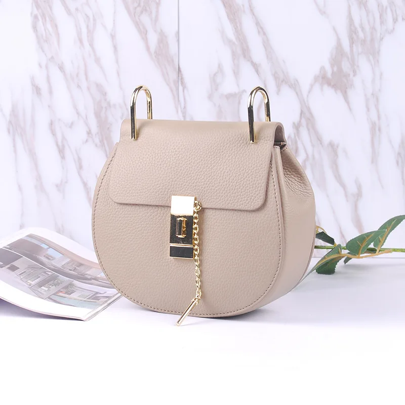 

Piggy bag 2018 New leather female bag lychee tattoo head layer cowhide buckle chain female bag oblique cross mini bag
