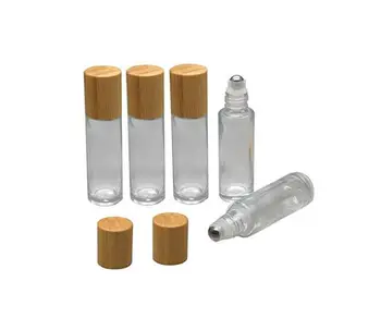 

Natural bamboo lid cosmetic packaging attar perfume clear 15ml roll on glass bottle with roller ball,1/2 oz glass perfume bottle
