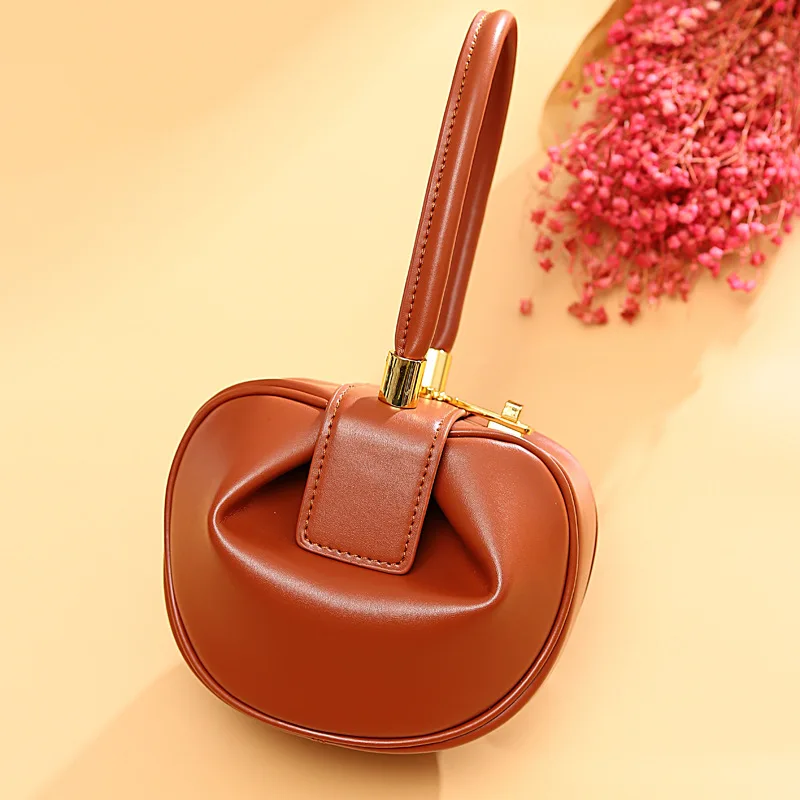

Jixiansheng's same genuine leather lady 2019 European and American fashion minority design hand-held jingling dumplings bags
