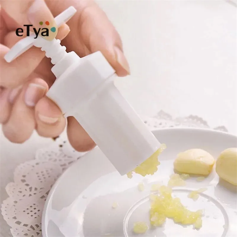 

eTya 1PC Kitchen Ginger Garlic Mesher Plastic Manual Press Twist Cutter Garlic Crusher Cooking Tools