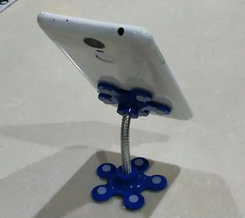 

2019 new multi-function magic sucker mobile phone holder desktop car navigation bracket