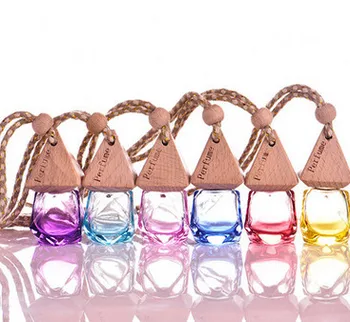

2017 New 100pcs 6ml Smell Of Perfume Pendant Car Accessories Pendant In Addition To Perfume Bottle Oil Car Perfume Bottles Car