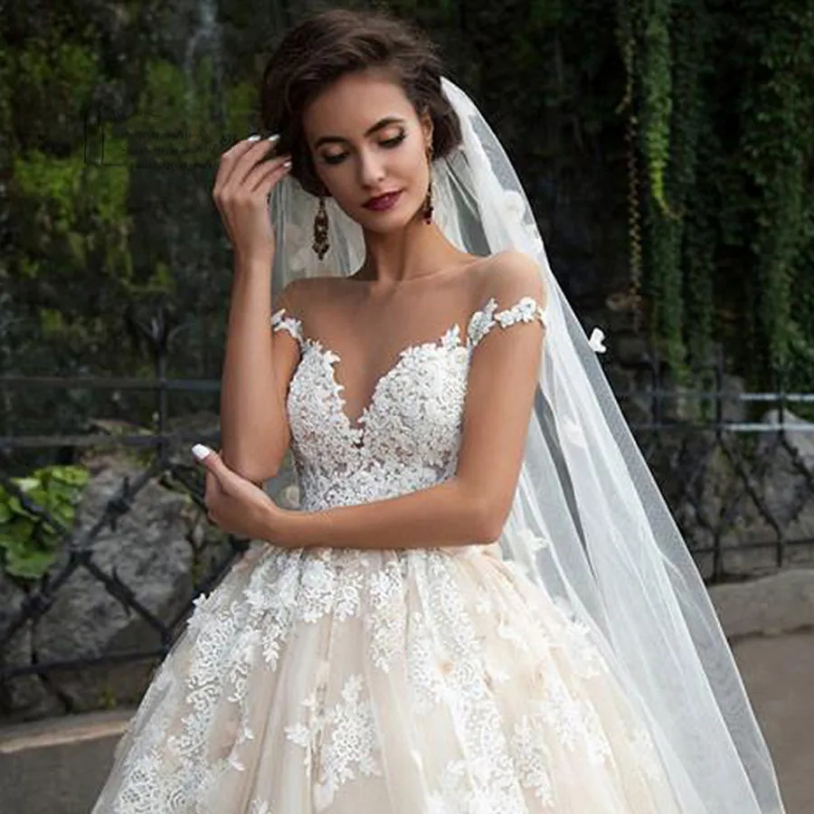 off the shoulder illusion wedding dress