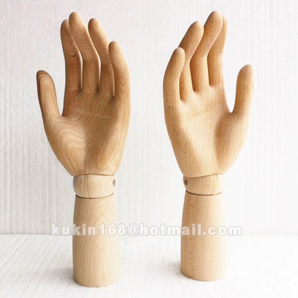 

Wooden mannequin hand with wood sculpture finger