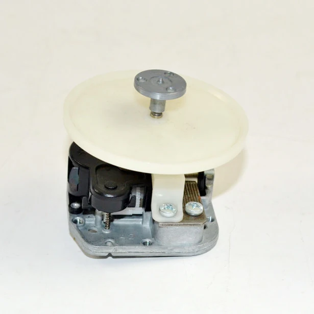 

DIY music box mechanism with rotating shaft and plate in contrary direction