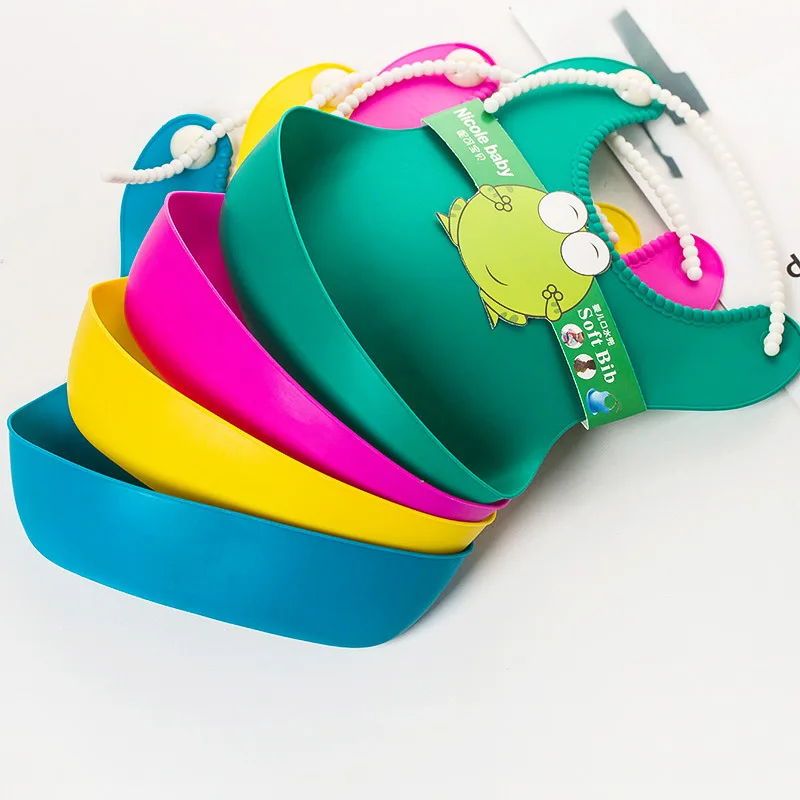 

8 colors available Wholesale Baby Bib Stereo Silica Gel Bib Plastic Leakproof Baby Free Rice Bag Soft Bib