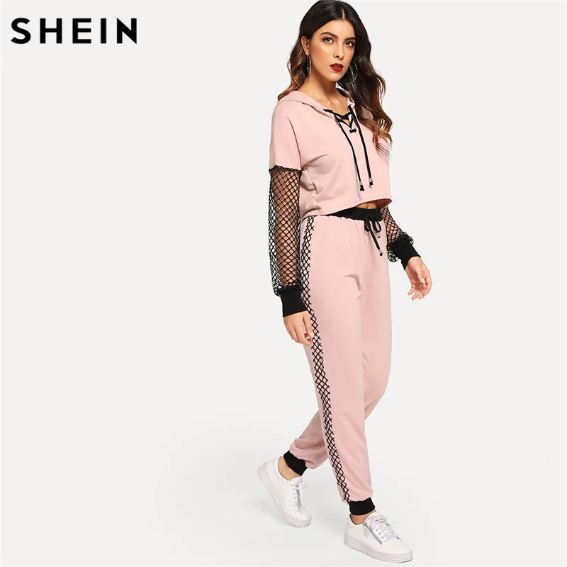 

SHEIN Pink Fishnet Sleeve Lace Up Hoodie Sweatpants Sporting Casual Two Piece Set Top and Pants Women Two Piece Outfits