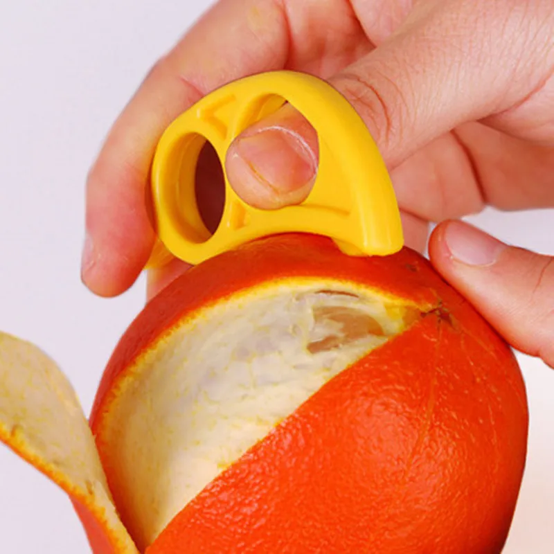 

1Pcs Creative Piece Orange Peeler Zesters Lemon Fruit Slicer Easy Uncoat Kitchen Knife Citrus Gadget (random color)