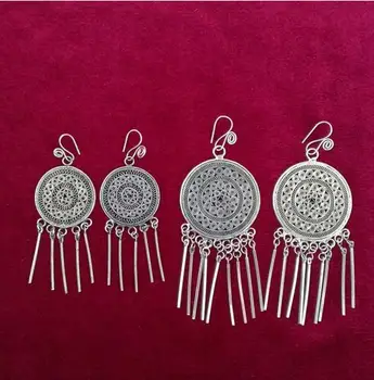 

Selling Jewelry>>Guizhou Miao handmade jewelry national wind handmade Miao earrings traditional pinch fillet copper drum tassel