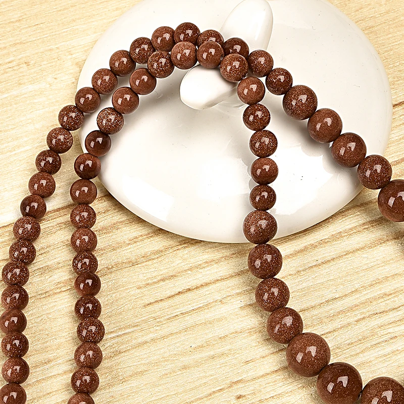 

Beads as as sand and golden Prominent jewelry Sand stone Necklace Brown beads give off an attractive sheen
