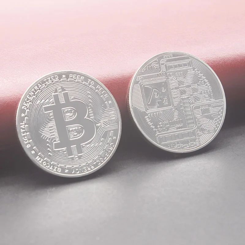 silver color bitcoin coin
