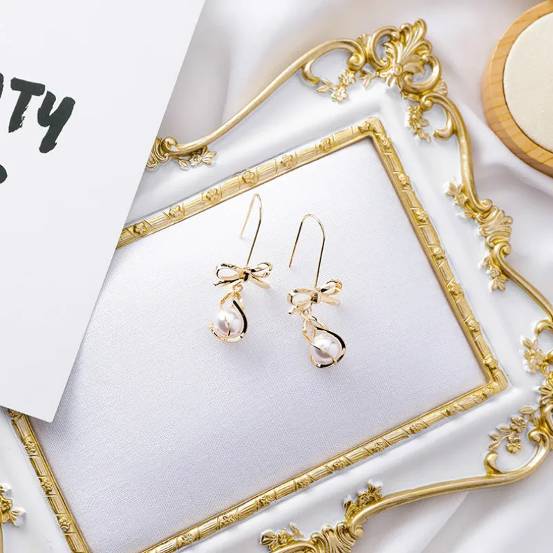 

Trendy Metal Water Drop Women Dangle Earrings Sweet Bow Metal Pearl Earrings For Women Drops Earrings Bohemian Earrings