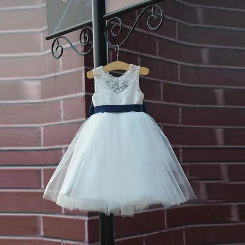 white flower girl dress with blue sash