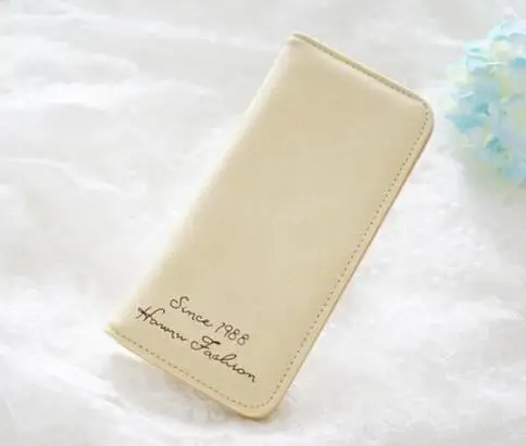 

2018 Q1 Creamy white ZIN73 wholesale lady's purse is wide and wide, with soft surface and a long vintage wallet ZIN 73