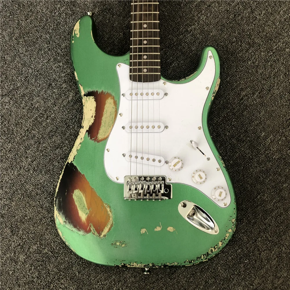 

Kaiyun factory custom handmade copy of old SRV ST electric guitars.100% handmade.Metallic green imitation old electric guitar.