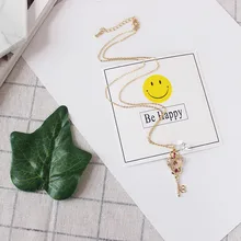 Free shipping fashion woman new jewelry Exquisite time and space key hollow synthetic gemstone chain Accessories girl