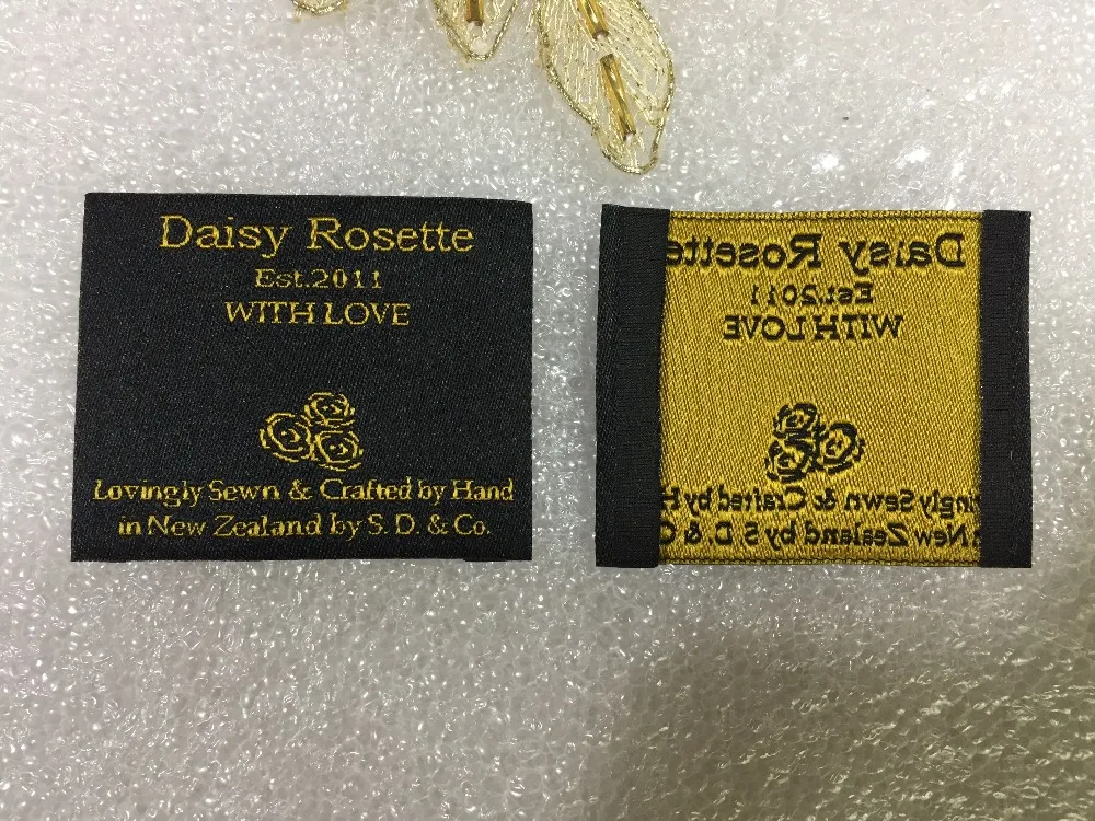 

Custom brand Garment labels and tags woven label end fold main labels private logo labels golden text black background
