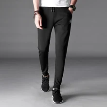 Высококачественные брендовые штаны для фитнеса, повседневные Модные эластичные черные штаны для мужчин, одежда для бодибилдинга, спортивные штаны, штаны для бега