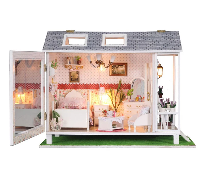 dollhouse with furniture and dolls
