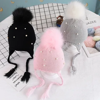 

Boy and girl hat Autumn and winter baby warm hats headgear new pearl big ball earmuffs Korean version of the baby wool hat caps