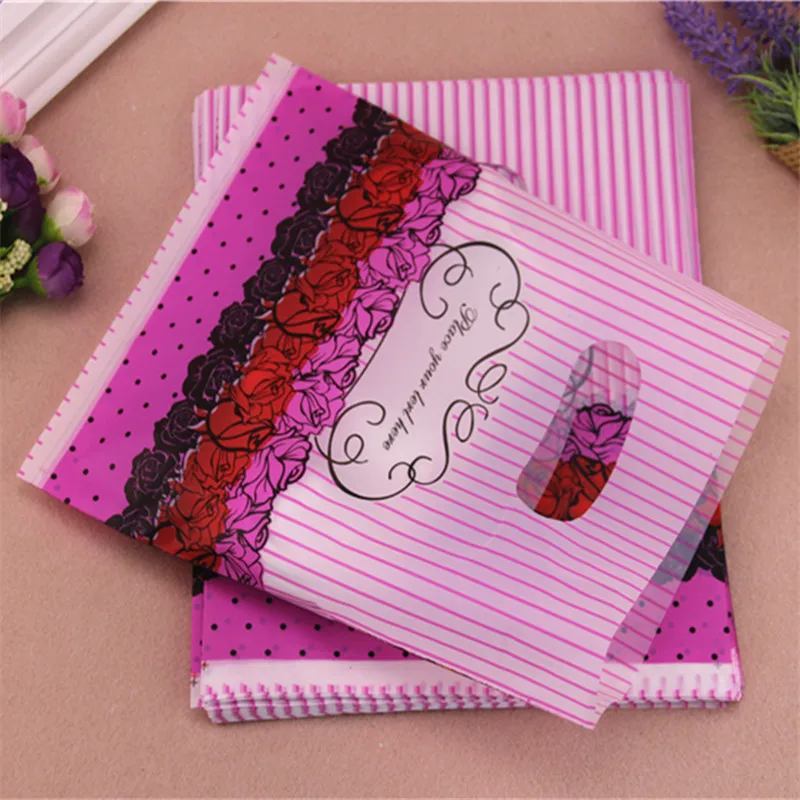 2016 New Design Wholesale 100pcs/lot 20*25cm Mixed Luxury Flower Plastic Packaging Bags With Handles Favor Wedding Gift Bags