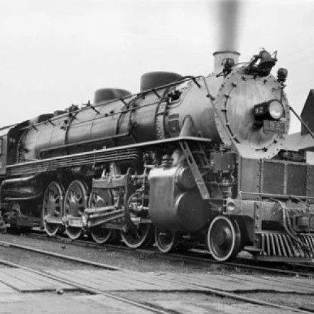 Steam train on a railroad track Poster Print (18 x 24)