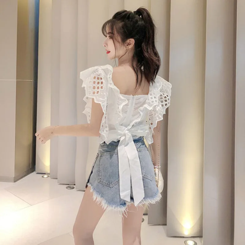 

New 2019 Summer 2 Piece Set Vintage Sexy Backless Lace Up Tops Women Hollow out Patchwork White Blouse+Tassel Denim Shorts Suits