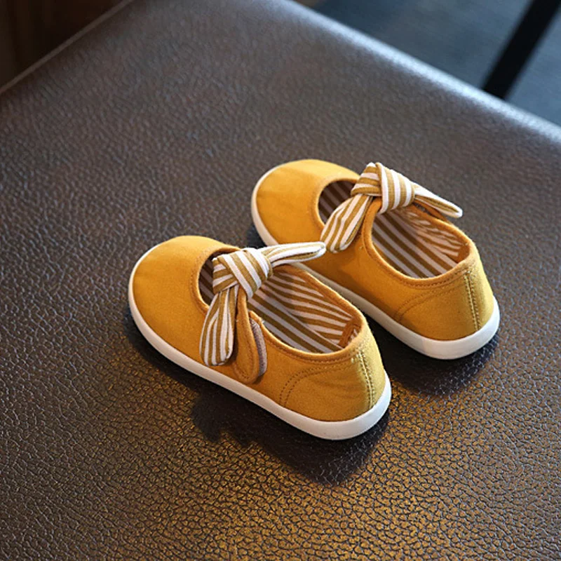 1Pair Yellow Baby First Walkers Solid Butterfly-Knot Fashion Soft Canvas Shoes Hook&Loop Lace-up Footwear Crib Shoes All Seasons classic casual baby shoes toddler newborn polka dots baby girls autumn lace up first walkers sneakers shoes